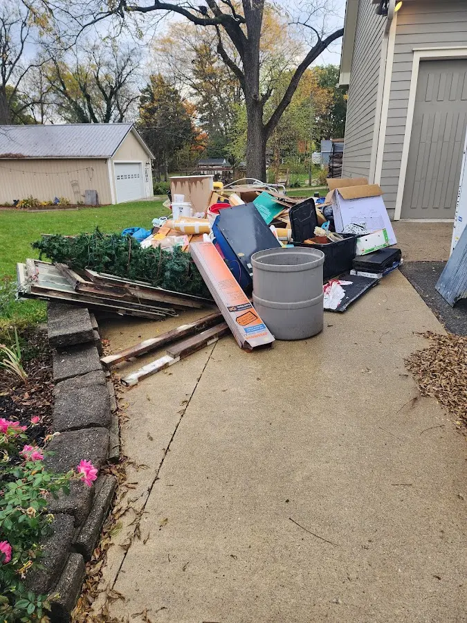 Dumpster being loaded with debris for Roofing Dumpster Rental in Lenoir City